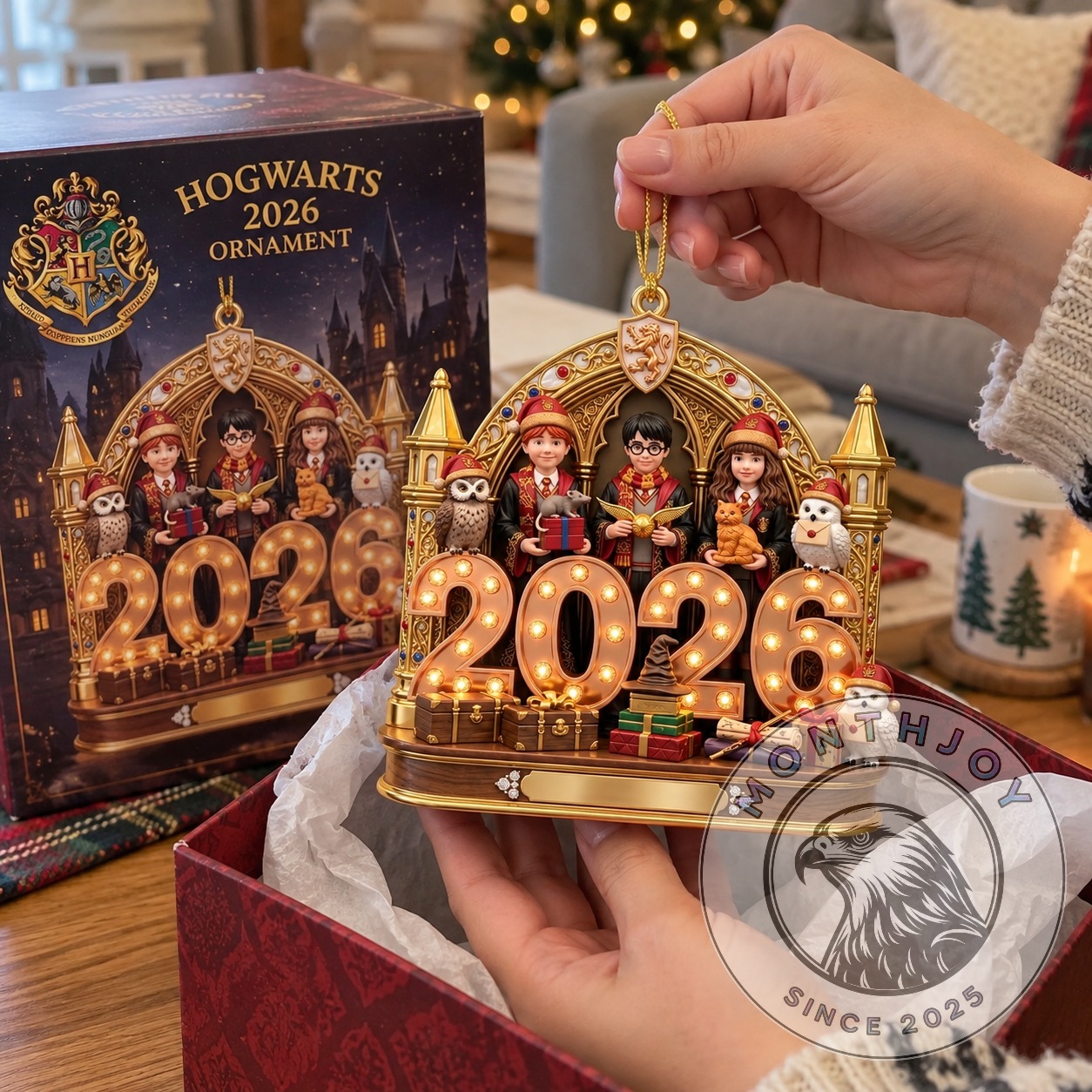 Harry Potter anniversary ornament with gold arch, owls, gifts, and number design